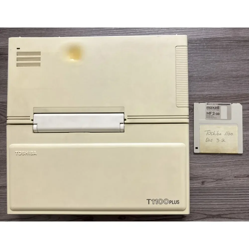 Vintage Toshiba T1100 Plus Laptop Computer with Maxell Micro Floppy Disk MF 2-DD